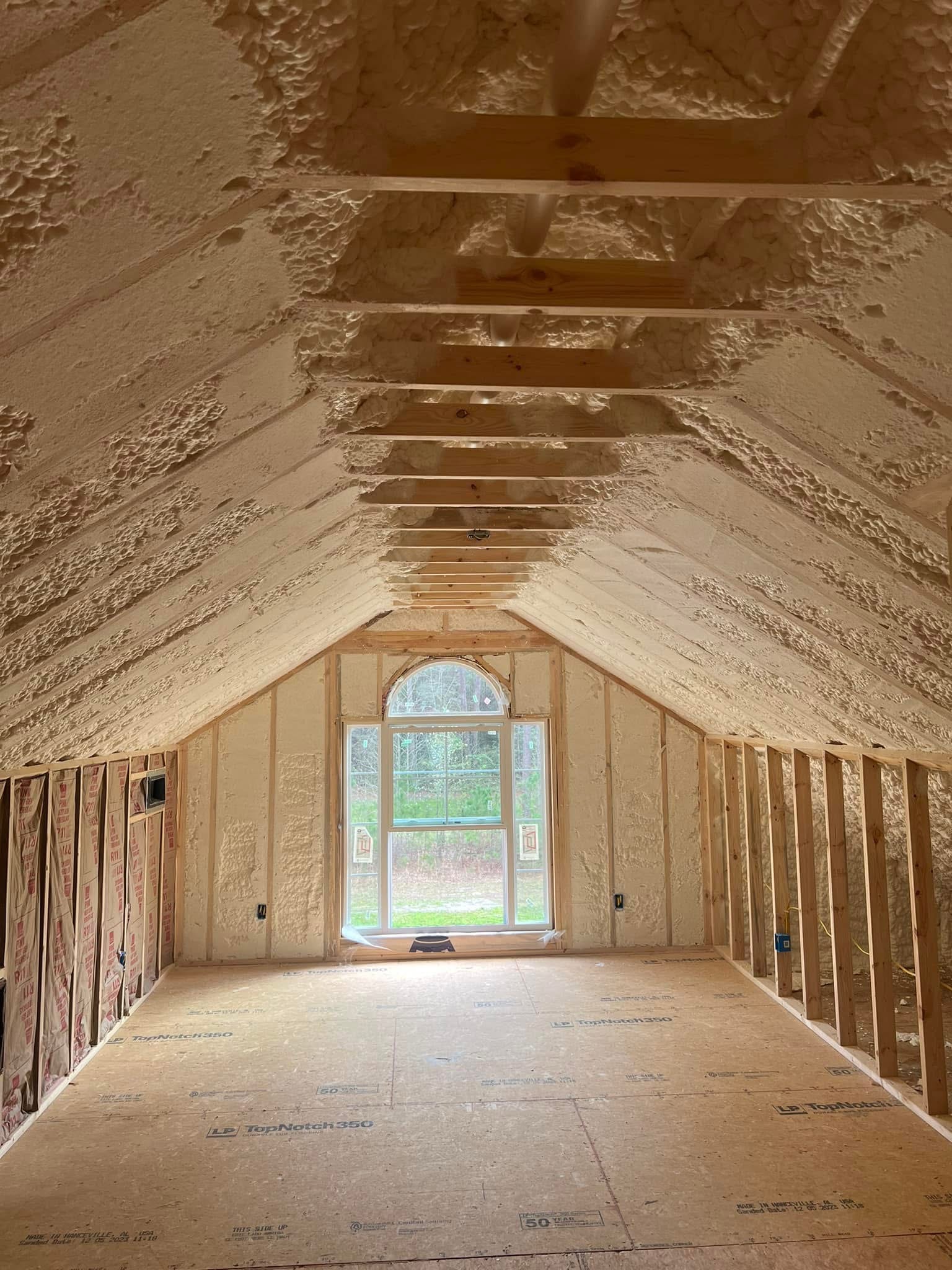 Finished attic loft with open-cell spray foam on vaulted ceiling and walls