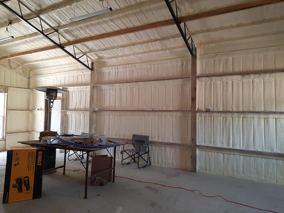 Metal warehouse interior before spray foam insulation